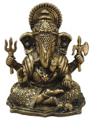An ornate brass Lord Ganesha idol, featuring detailed carvings, a radiant halo, and symbolic trident and axe weapons, set against a neutral gray background.